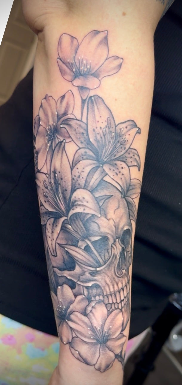 Black and grey floral arm tattoo — by Chelsea Hughes