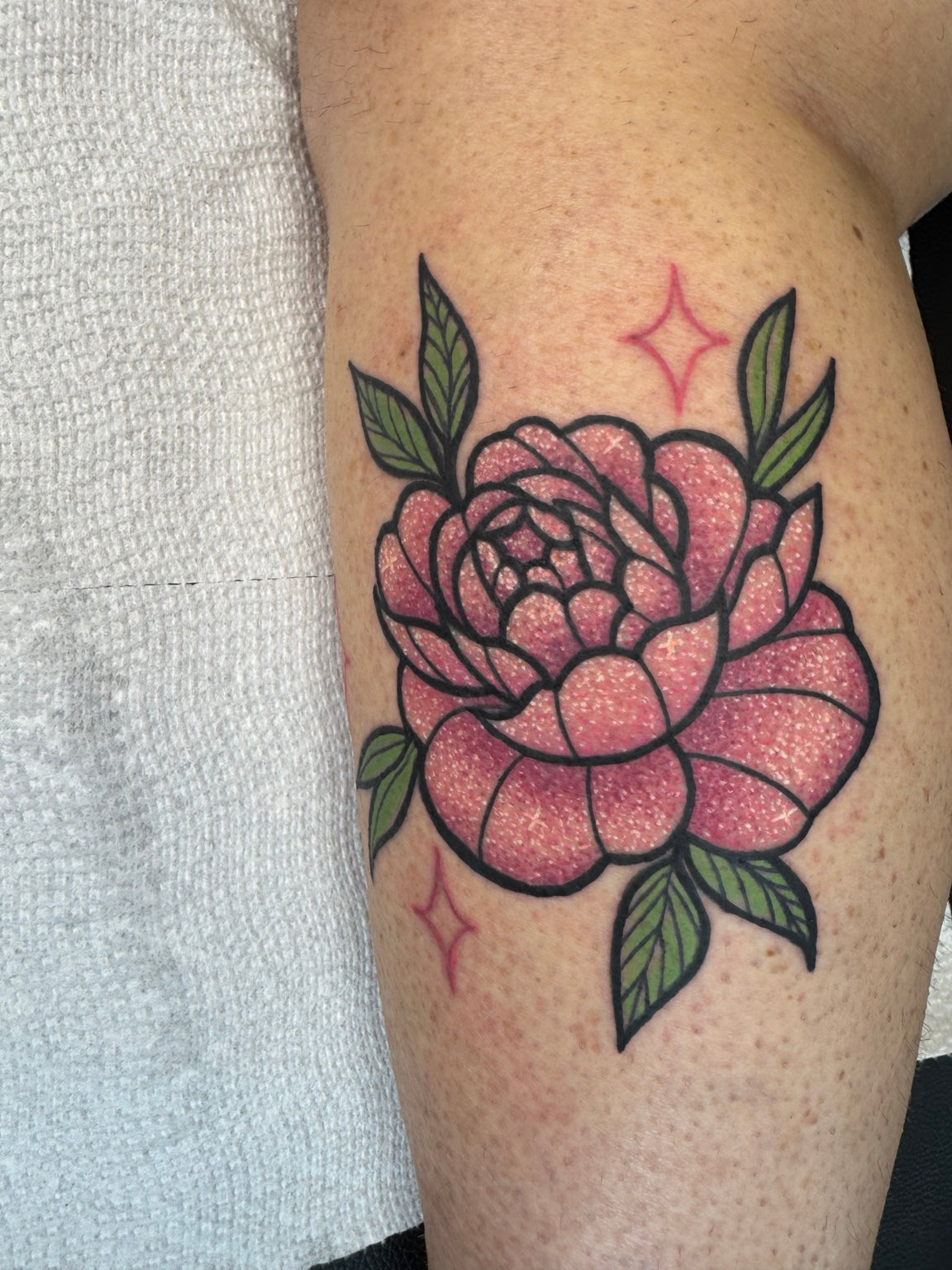 Traditional pink flower tattoo — by Chelsea Hughes